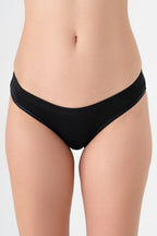 Women's organic cotton briefs in black, front view on model