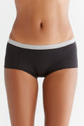 Women's organic cotton boyshorts in black with grey waistband, front view on model