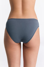 Women's classic organic cotton briefs in Dark Slate, back view on model