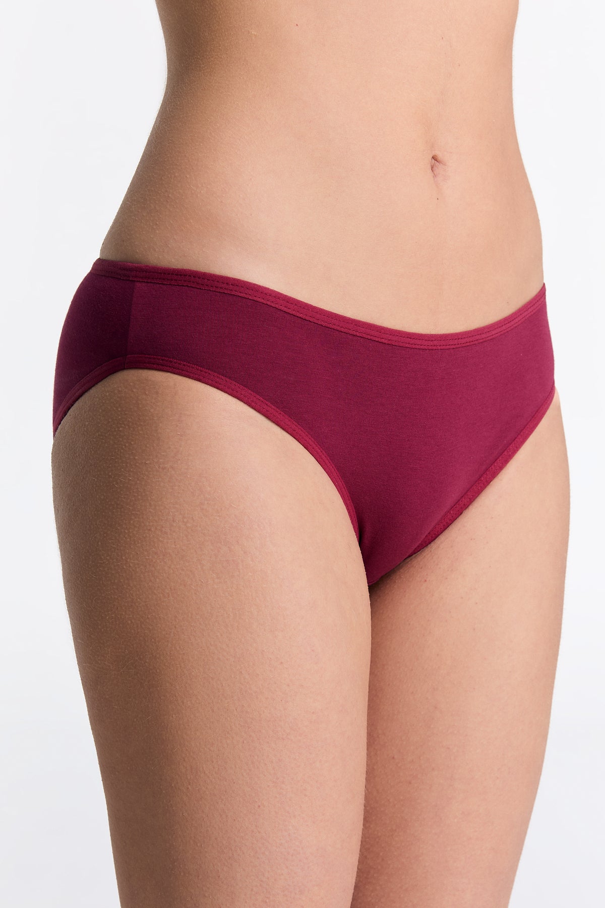 Women's classic organic cotton briefs in Rosarot, side view on model