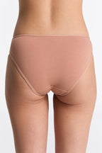 Women's classic organic cotton briefs in Café Crema, back view on model