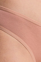 Women's classic organic cotton briefs in Café Crema, close-up of the soft stretch jersey