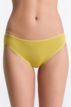 Women's classic organic cotton briefs in lime, front view on model