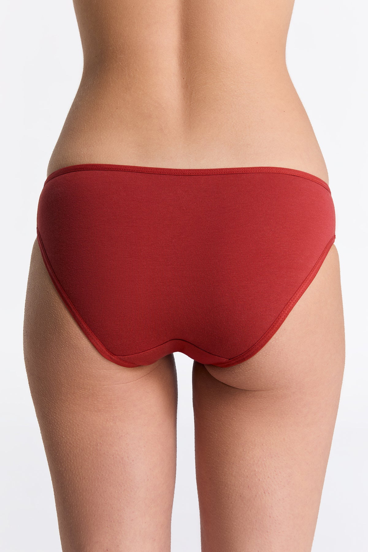 Women's classic organic cotton briefs in red, back view on model