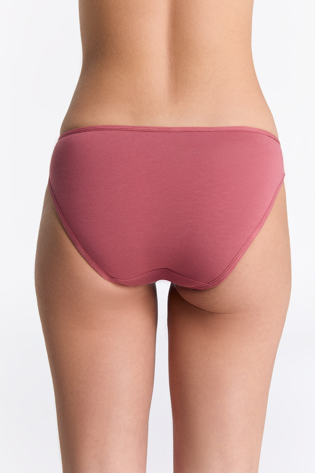 Women's classic organic cotton briefs in Faded Rose, back view on model