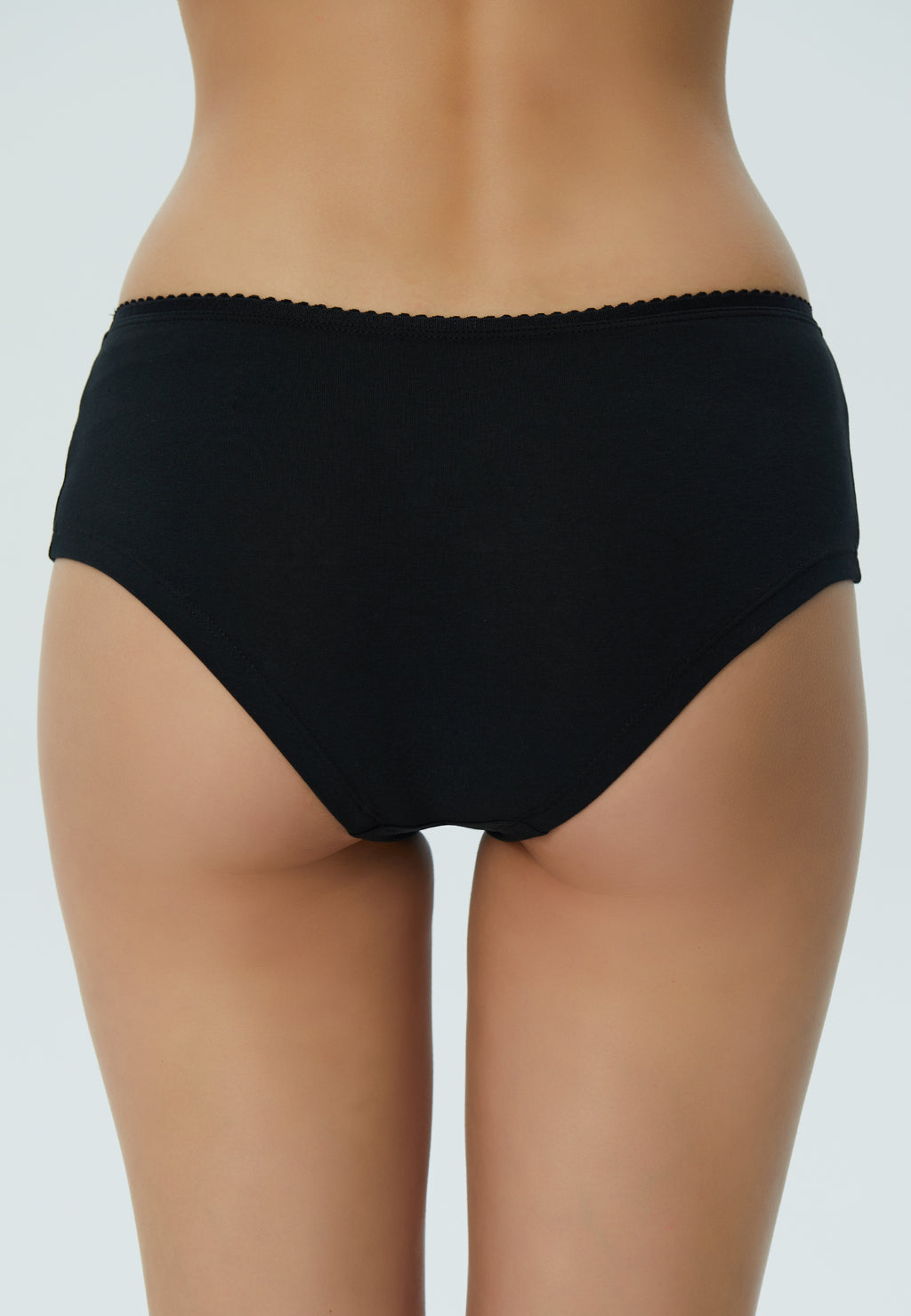 Women's organic cotton hipster with lace waistband in black, back view on model