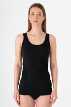 Women's organic cotton tank top in black, front view on model