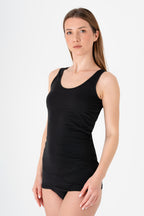 Women's organic cotton tank top in black, side view on model