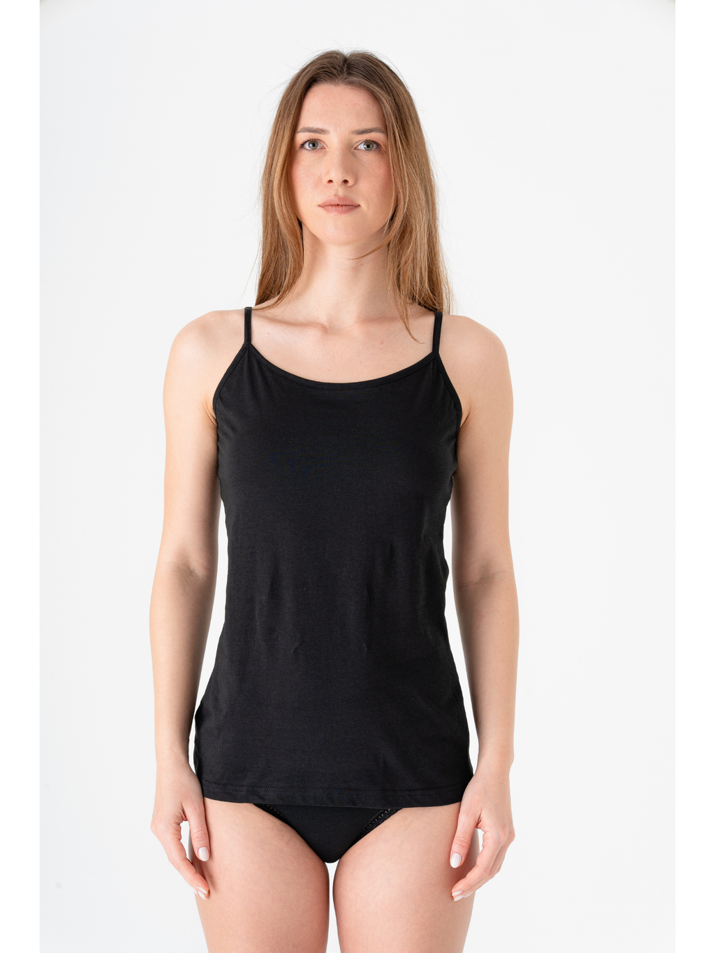 Women's organic cotton camisole with adjustable straps in black, front view on model