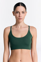 Women's organic cotton bralette in Dark Green, front view on model