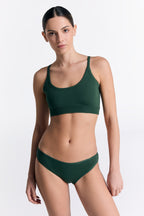Women's classic organic cotton briefs in Dark Green, worn with the matching organic cotton bralette, front view