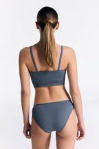 Women's organic cotton bralette in Dark Slate, worn with matching classic briefs, back view