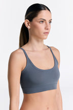 Women's organic cotton bralette in Dark Slate, side view on model