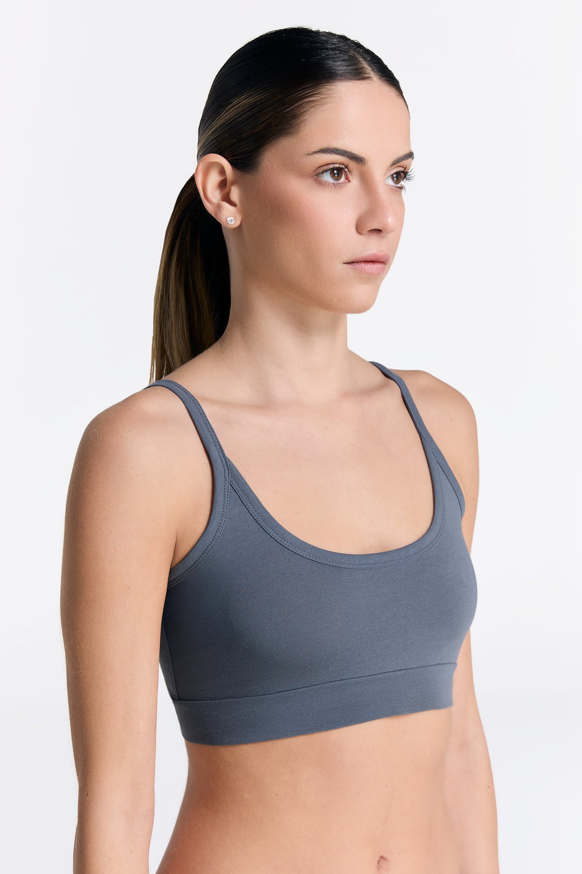 Women's organic cotton bralette in Dark Slate, side view on model