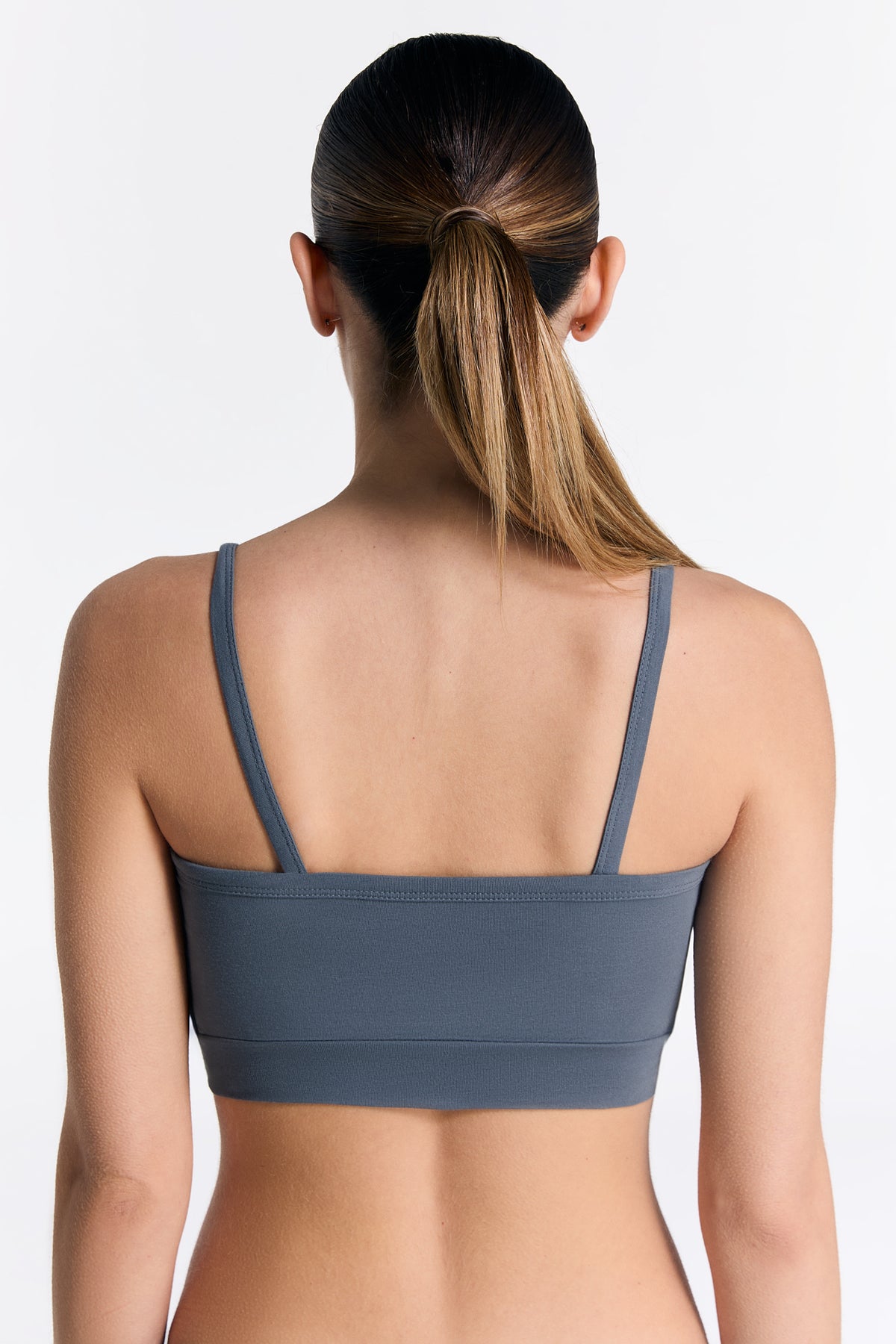 Women's organic cotton bralette in Dark Slate, back view on model