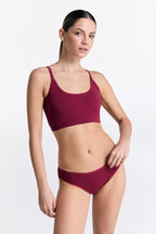 Women's classic organic cotton briefs in Rosarot, worn with the matching organic cotton bralette, front view