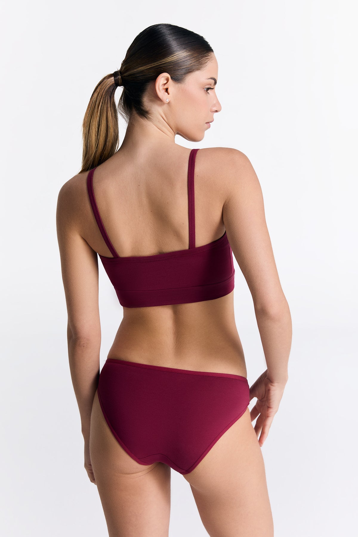 Women's classic organic cotton briefs in Rosarot, worn with the matching organic cotton bralette, back view