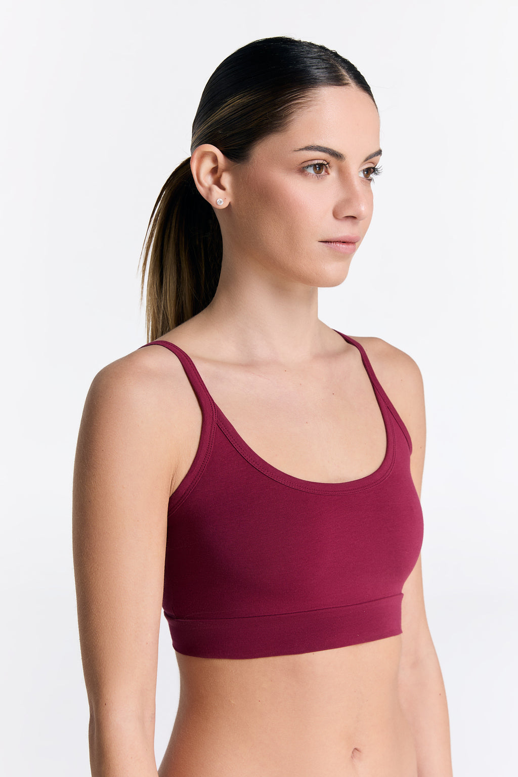Women's organic cotton bralette in Rosarot, side view on model