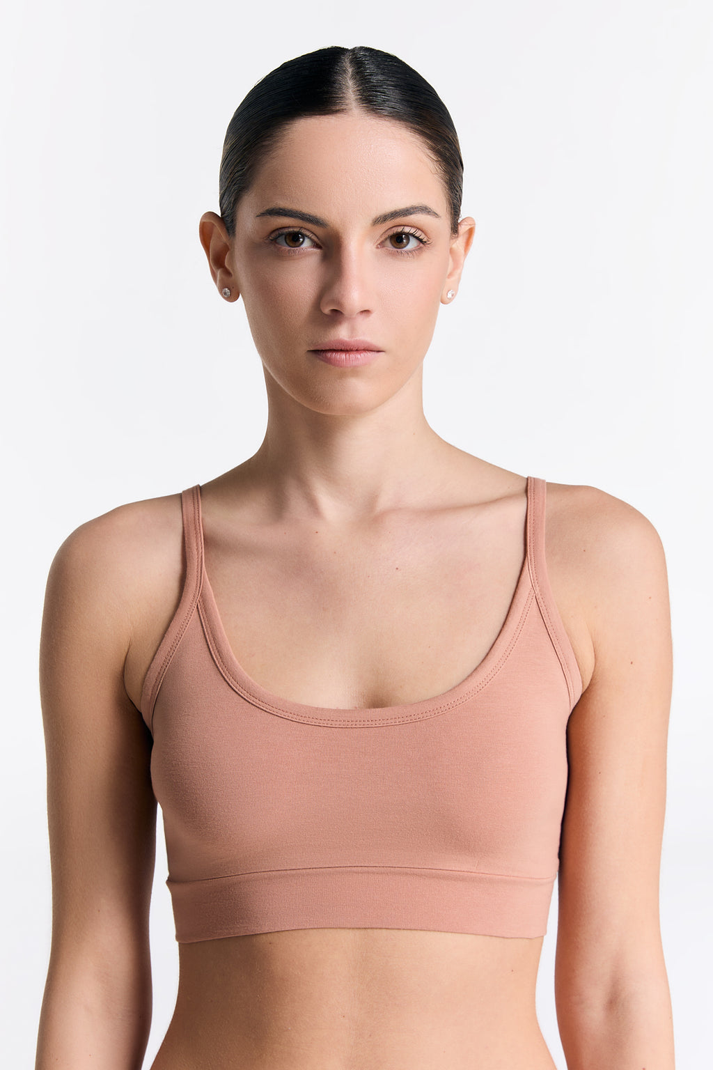 Women's organic cotton bralette in Café Crema, front view on model
