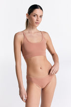 Women's classic organic cotton briefs in Café Crema, worn with the matching organic cotton bralette, front view