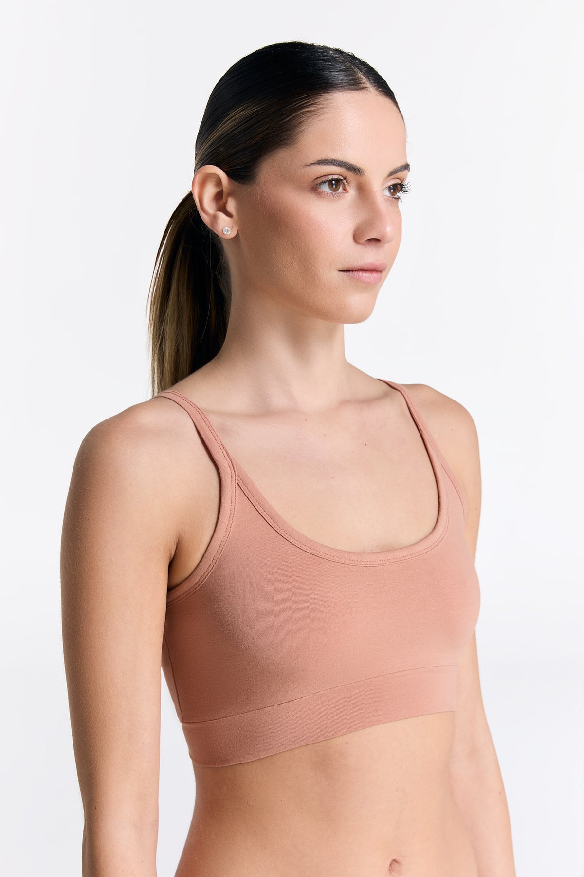 Women's organic cotton bralette in Café Crema, side view on model