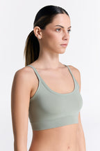 Women's organic cotton bralette in Iceberg Green, side view on model