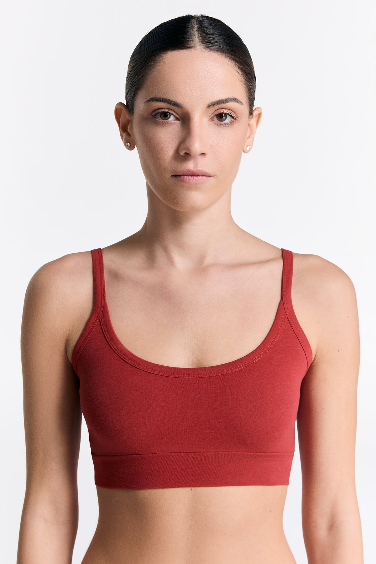 Women's organic cotton bralette in red, front view on model
