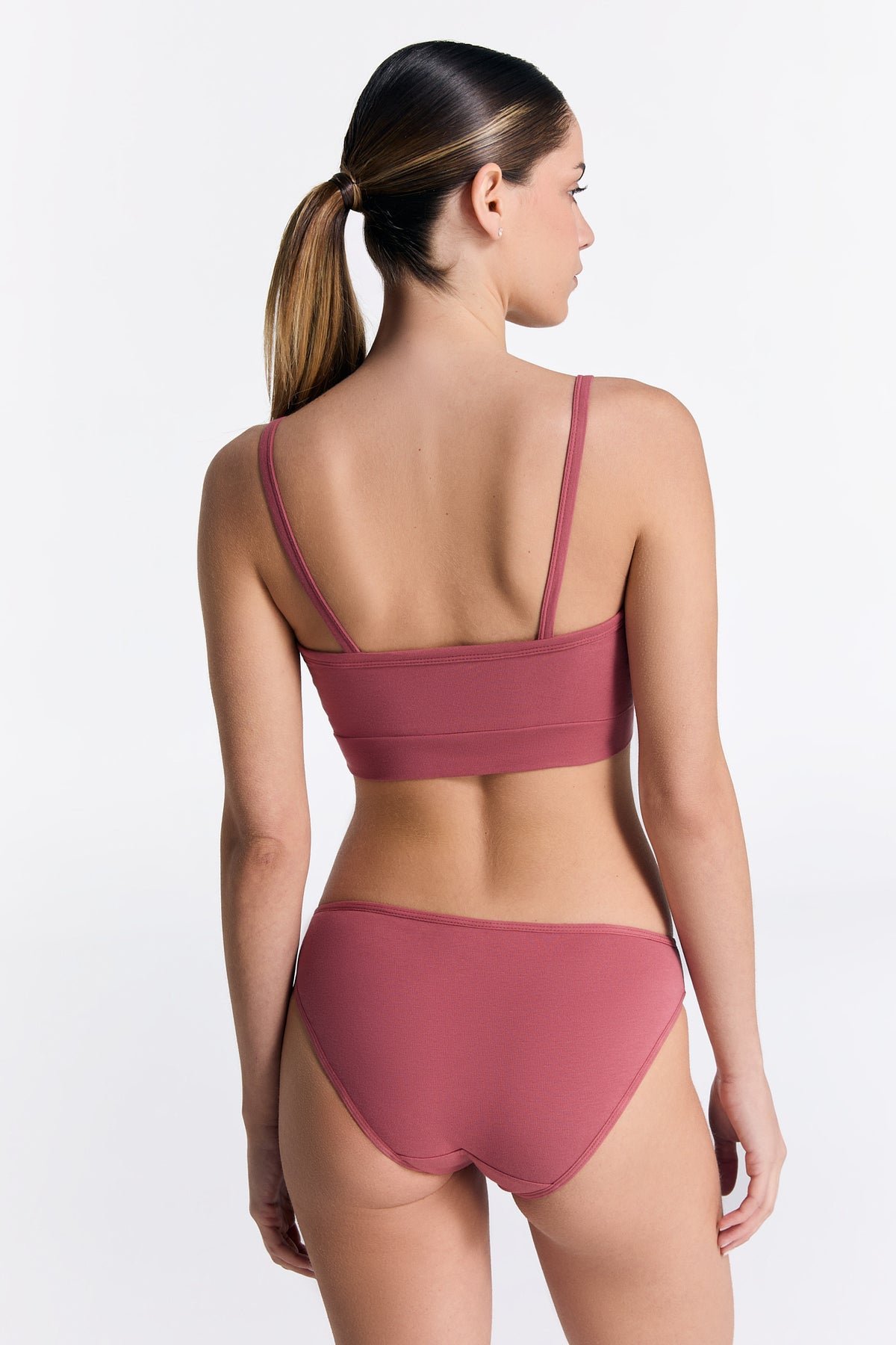 Women's organic cotton bralette in Faded Rose, worn with matching classic briefs, back view