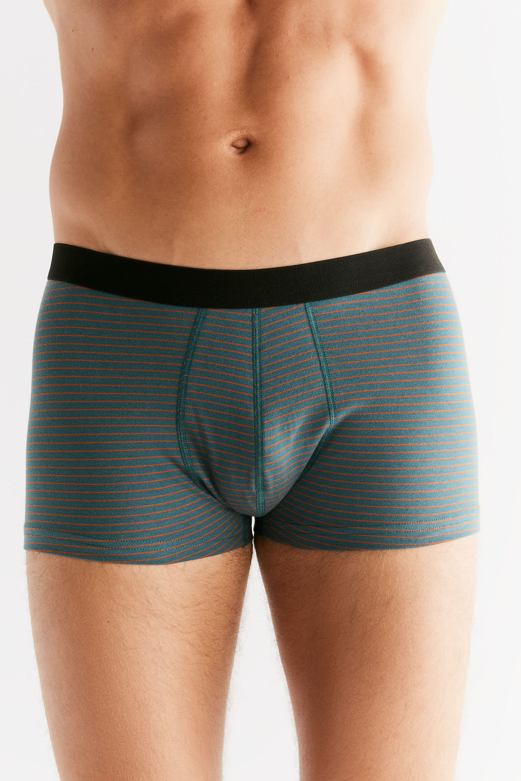Men's organic cotton trunks in Fir Tabasco, front view on model