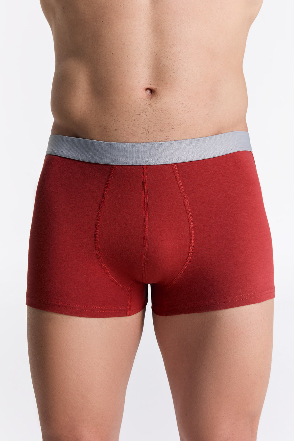 Men's organic cotton trunks in red, front view on model