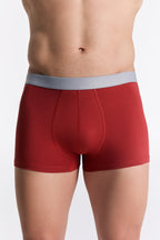 Men's organic cotton trunks in red, front view on model