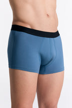 Men's organic cotton trunks in Alpine Grey, side view on model