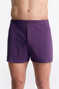 Men's organic cotton boxer shorts in Weinbeere, front view on model